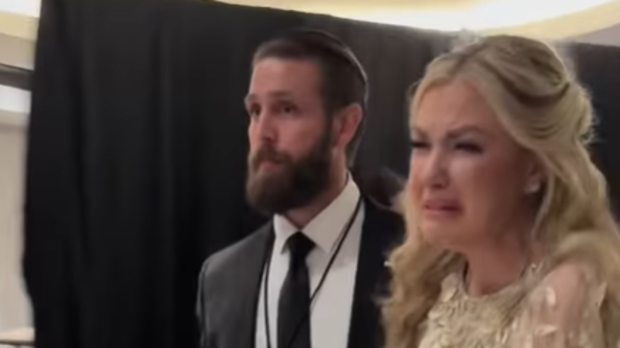 Kirk was seen being escorted out of the event.