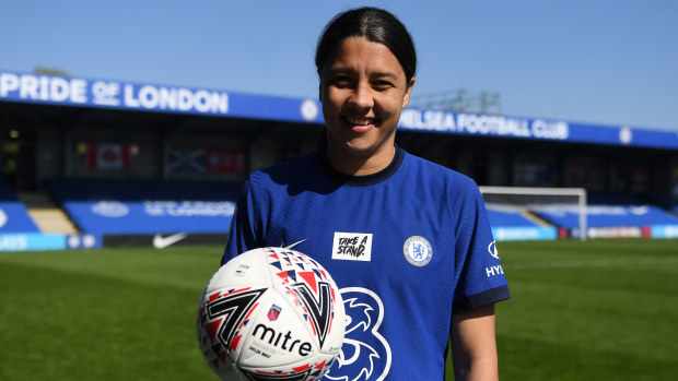 Sam Kerr poses with the match ball after scoring a hat-trick against Birmingham City.