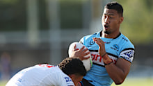 Ronaldo Mulitalo of the Sharks is tackled.