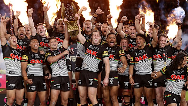 The Panthers celebrate with the NRL Premiership Trophy after victory in the 2022 NRL grand final.