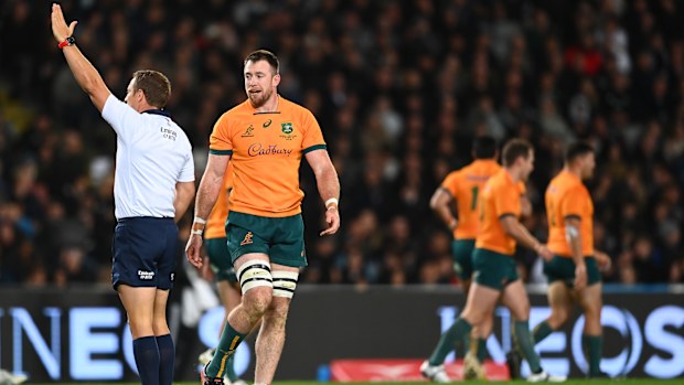 Jed Holloway of the Wallabies receives a yellow card from referee Andrew Brace.
