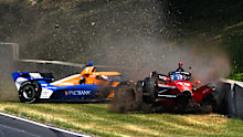 Will Power (right) slams into the concrete wall after Scott Dixon veered into his path during practice.