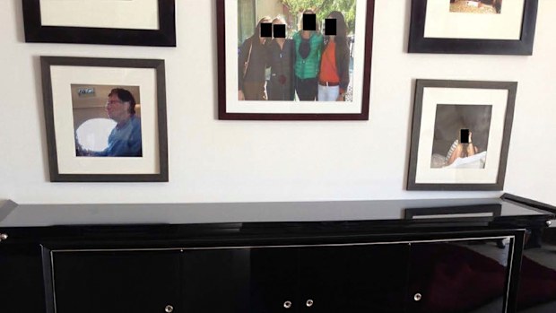 This undated, redacted photo released by Democrats on the House Oversight Committee shows a framed photo of Bill Gates. (House Oversight Committee via AP)