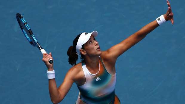 Garbine Muguruza of Spain serves in her first round singles match against Clara Burel of France during day two of the 2022 Australian Open at Melbourne Park.