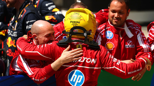 Sprint winner Lewis Hamilton of Great Britain and Scuderia Ferrari celebrates in parc ferme with his team during the Sprint ahead of the F1 Grand Prix of China at Shanghai International Circuit on March 22, 2025 in Shanghai, China. (Photo by Clive Rose/Getty Images)