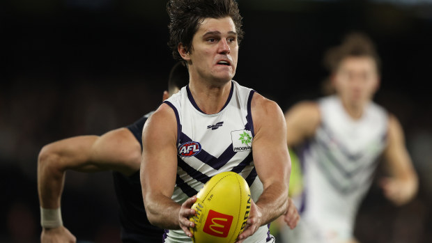 MELBOURNE, AUSTRALIA - JUNE 25: Lachie Schultz of the Dockers runs with the ball during the round 15 AFL match between the Carlton Blues and the Fremantle Dockers at Marvel Stadium on June 25, 2022 in Melbourne, Australia. (Photo by Robert Cianflone/Getty Images)