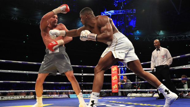 Anthony Joshua and Wladimir Klitschko in action during the IBF, WBA and IBO Heavyweight World Title bout at Wembley Stadium.