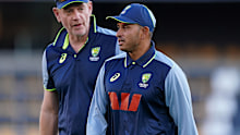 Usman Khawaja speaks with coach Andrew McDonald