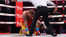 Jake Paul is knocked down against Anthony Joshua in their heavyweight bout.