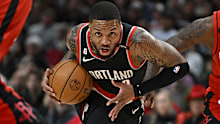 PORTLAND, OREGON - FEBRUARY 26: Damian Lillard #0 of the Portland Trail Blazers drives to the basket against Tari Eason #17 and Alperen Sengun #28 of the Houston Rockets during the first quarter at the Moda Center on February 26, 2023 in Portland, Oregon. NOTE TO USER: User expressly acknowledges and agrees that, by downloading and or using this photograph, User is consenting to the terms and conditions of the Getty Images License Agreement. (Photo by Alika Jenner/Getty Images)