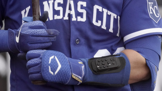 Kansas City Royals catcher Cam Gallagher wears the wrist-worn device used to call pitches.