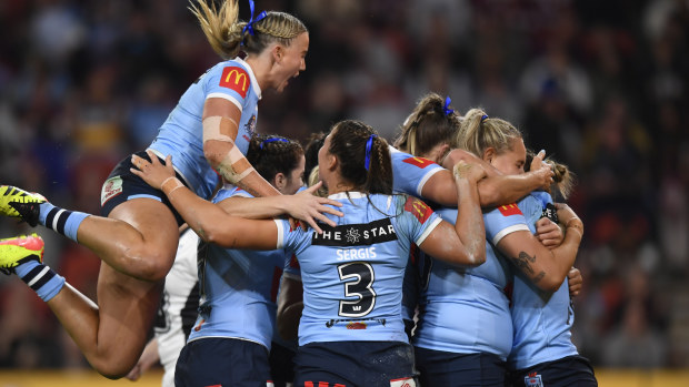 NSW celebrate the opening try of the night against Queensland in the women's State of Origin series opener.
