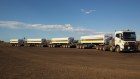 Brockman plans to use long road trains known as "Super Quads" to haul iron ore.