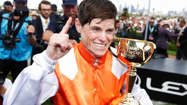 Craig Williams celebrates his Melbourne Cup triumph.