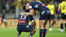 Filipo Daugunu and Lachie Anderson of the Rebels react after the final whistle.