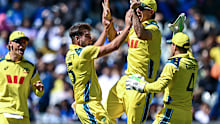 Xavier Bartlett of Australia celebrates the wicket of Virat Kohli.