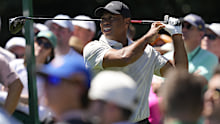 Tiger Woods watches his tee shot on the ninth hole during third round.