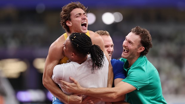 Armand Duplantis celebrates his latest world record with Emmanouil Karalis and Kurtis Marschall.