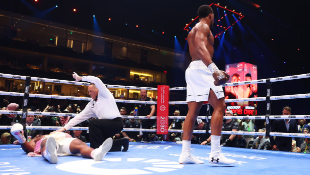 Francis Ngannou is knocked down for the third time as Referee Ricky Gonzalez stops the fight and checks on him during the Heavyweight fight between Anthony Joshua and Francis Ngannou on the Knockout Chaos boxing card at the Kingdom Arena on March 08, 2024 in Riyadh, Saudi Arabia. (Photo by Richard Pelham/Getty Images)