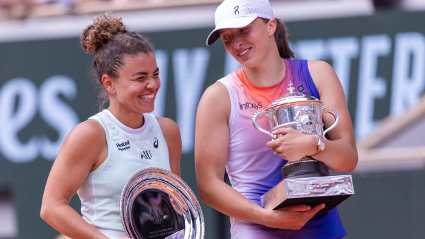 Jasmine Paolini of Italy and Iga Swiatek of Poland react with their runners-up and winners trophies after the Women's Singles Final match on Day 14 of the 2024 French Open at Roland Garros on June 08, 2024 in Paris, France. (Photo by Tnani Badreddine/DeFodi Images via Getty Images)