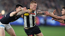 Jordan De Goey competes with Matt Kennedy and George Hewett in the Pies vs Carlton round 21 clash.