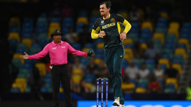 Mitchell Starc of Australia reacts after a suffering an apparent calf injury in a delivery during the ICC Men's T20 Cricket World Cup West Indies & USA 2024 match between Australia  and Oman at  Kensington Oval on June 05, 2024 in Bridgetown, Barbados. (Photo by Gareth Copley/Getty Images)