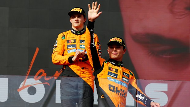 Race winner Lando Norris and runner-up Oscar Piastri stand on the podium after the Hungarian Grand Prix. 