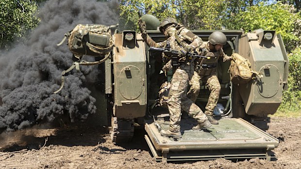 Ukrainian servicemen of 13th brigade take part in training at the training field in Kharkiv region, Ukraine Friday, Aug. 29, 2024. (AP Photo/Andrii Marienko)