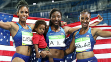 Nia Ali holds her son Titus after winning a silver medal in Rio.