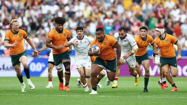 Taniela Tupou of Australia breaks forward with the ball during the Rugby World Cup.