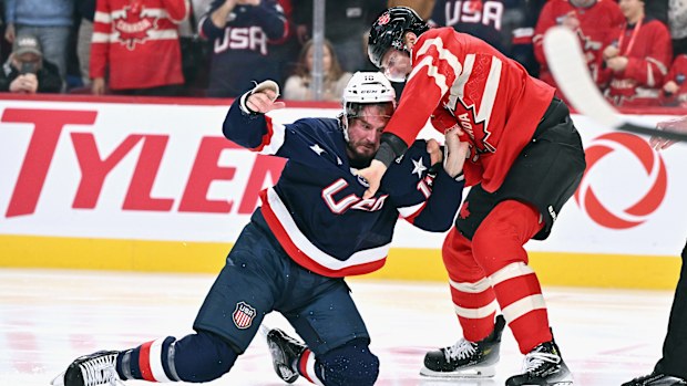 J.T. Miller #10 of Team USA and Colton Parayko #55 of Team Canada fight.
