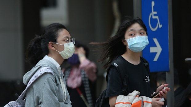 People wear face masks to protect against the spread of the coronavirus in Taipei, Taiwan.