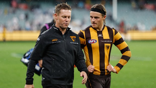 Sam Mitchell walks with Jack Ginnivan.
