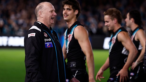 Power coach Ken Hinkley sprays Hawks players after their final.