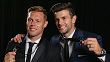 Sam Mitchell and Trent Cotchin receive the 2012 Brownlow Medal.