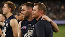 Carlton coach Michael Voss and Sam Docherty.