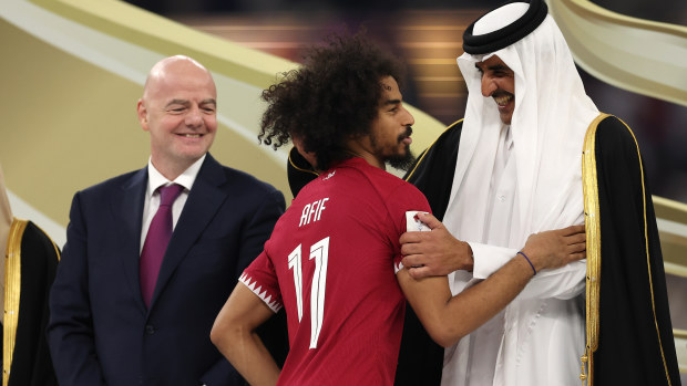 Akram Afif of Qatar interaqcts with Tamim bin Hamad Al Thani, Emir of Qatar after the AFC Asian Cup final match between Jordan and Qatar at Lusail Stadium on February 10, 2024 in Lusail City, Qatar. (Photo by Robert Cianflone/Getty Images)