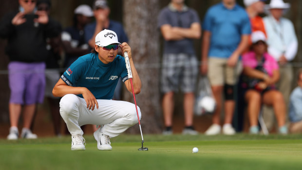 Min Woo Lee of Australia lines up a putt on the 15th green during the final round of THE PLAYERS Championship on THE PLAYERS Stadium Course at TPC Sawgrass on March 12, 2023 in Ponte Vedra Beach, Florida. (Photo by Mike Ehrmann/Getty Images)