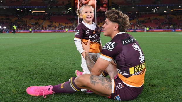 Reece Walsh of the Broncos celebrates with his daughter Leila after winning the NRL Preliminary Final match between Brisbane Broncos and New Zealand Warriors at Suncorp Stadium on September 23, 2023 in Brisbane, Australia. (Photo by Bradley Kanaris/Getty Images)