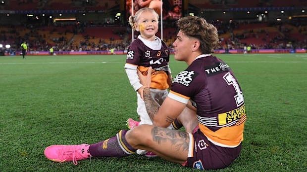 Reece Walsh of the Broncos celebrates with his daughter Leila after winning the NRL Preliminary Final match between Brisbane Broncos and New Zealand Warriors at Suncorp Stadium on September 23, 2023 in Brisbane, Australia. (Photo by Bradley Kanaris/Getty Images)