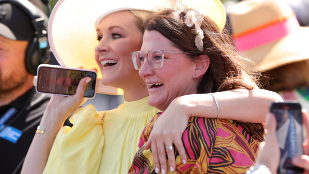 Mark Zahra's wife Elyse (L) and sister Claire (R) celebrate his 2023 Melbourne Cup win on Without A Fight