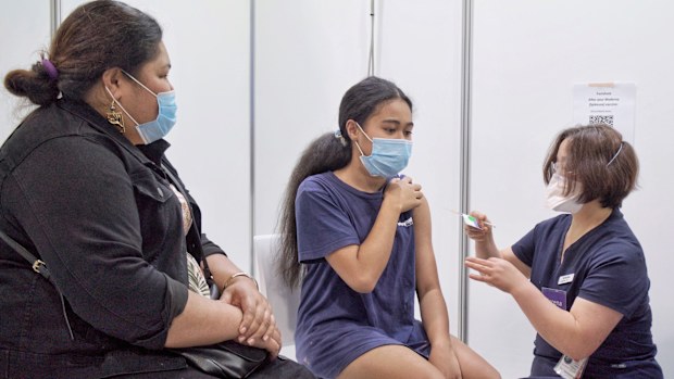 A young woman gets vaccinated in Dandenong, Melbourne.