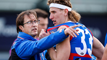 BALLARAT, AUSTRALIA - JULY 29: Luke Beveridge, Senior Coach of the Bulldogs speaks with Aaron Naughton of the Bulldogs during the 2023 AFL Round 20 match between the Western Bulldogs and the GWS GIANTS at Mars Stadium on July 29, 2023 in Ballarat, Australia. (Photo by Dylan Burns/AFL Photos via Getty Images)