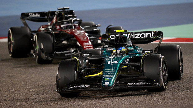 Fernando Alonso of Spain driving the (14) Aston Martin AMR23 Mercedes leads Valtteri Bottas of Finland driving the (77) Alfa Romeo F1 C43 Ferrari during the F1 Grand Prix of Bahrain at Bahrain International Circuit on March 05, 2023 in Bahrain, Bahrain. (Photo by Clive Mason/Getty Images)