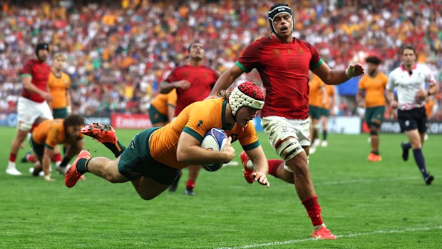 Fraser McReight of Australia scores his team's fourth try.