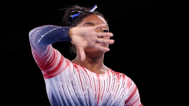 Simone Biles warms up at the Tokyo Olympics