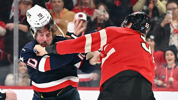 J.T. Miller #10 of Team USA and Colton Parayko #55 of Team Canada fight.