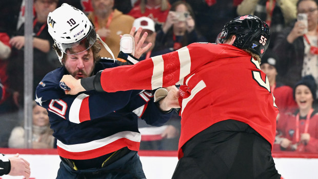 J.T. Miller #10 of Team USA and Colton Parayko #55 of Team Canada fight.