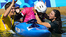 Noemie Fox of Australia reacts to winning gold in the women's kayak cross finals with her sister Jessica Fox, right, during the canoe slalom at the 2024 Summer Olympics, Monday, Aug. 5, 2024, in Vaires-sur-Marne, France. 