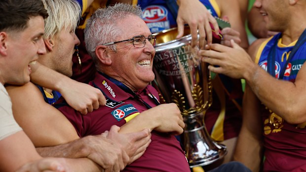 Chris Fagan, Senior Coach of the Lions celebrates with his team during the 2024 AFL Grand Final.